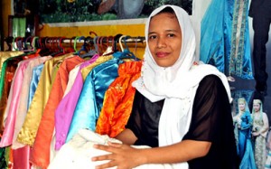 Rabia at work at her dress shop in Cotabato City.